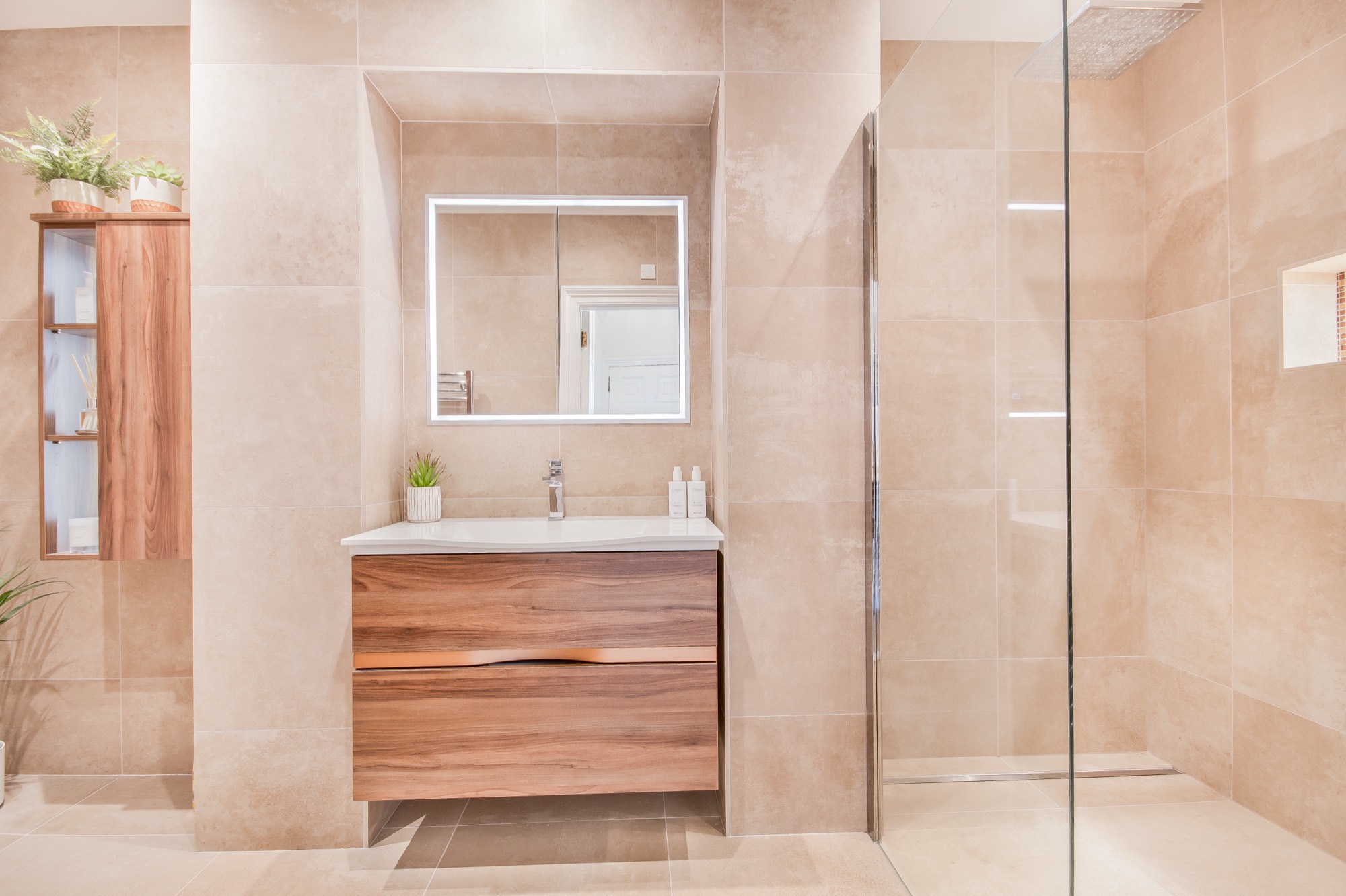 Stone-tiled bathroom with walk-in shower